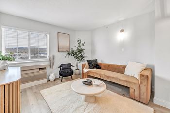 A living room with a couch and a coffee table